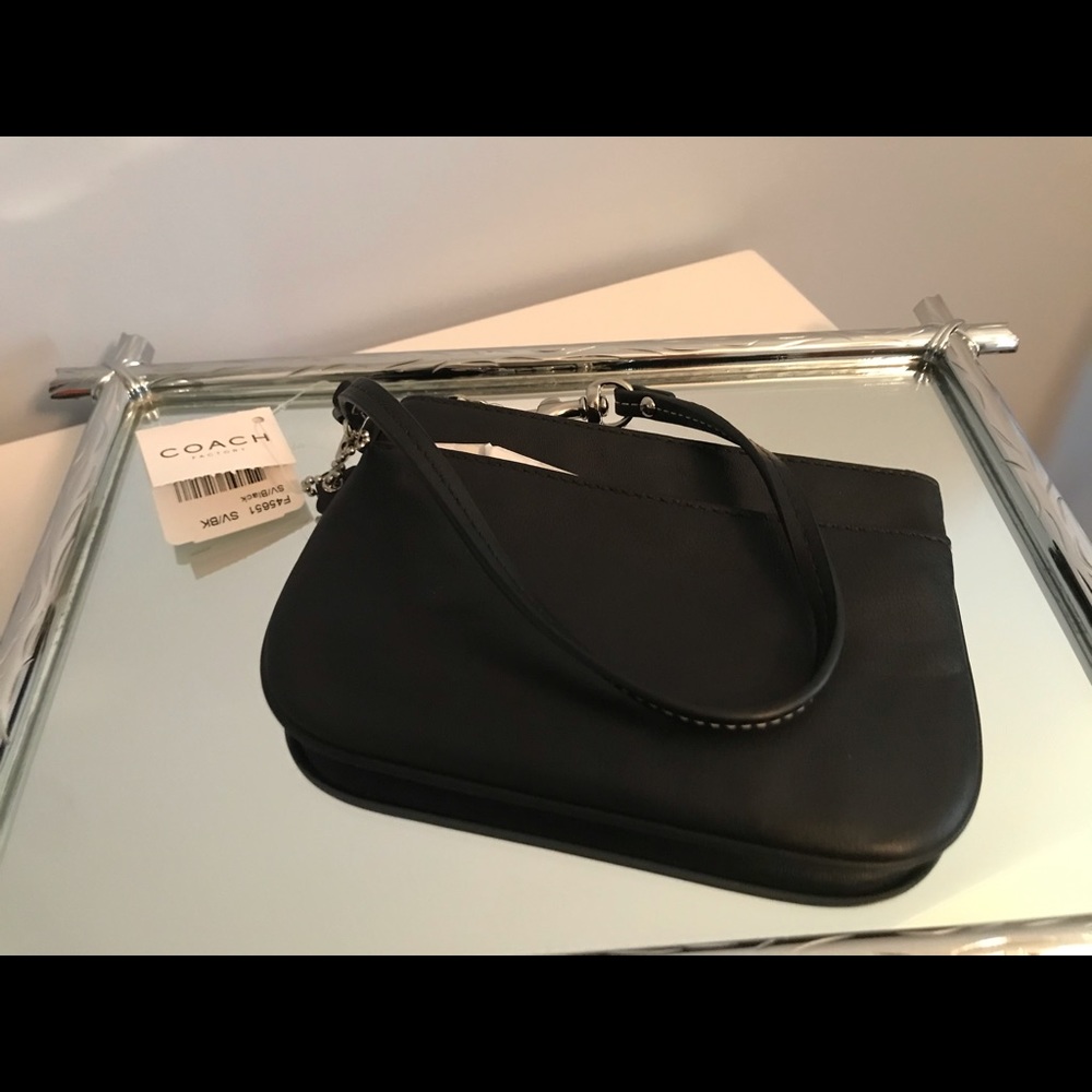 Coach - black leather wristlet with silver accents
